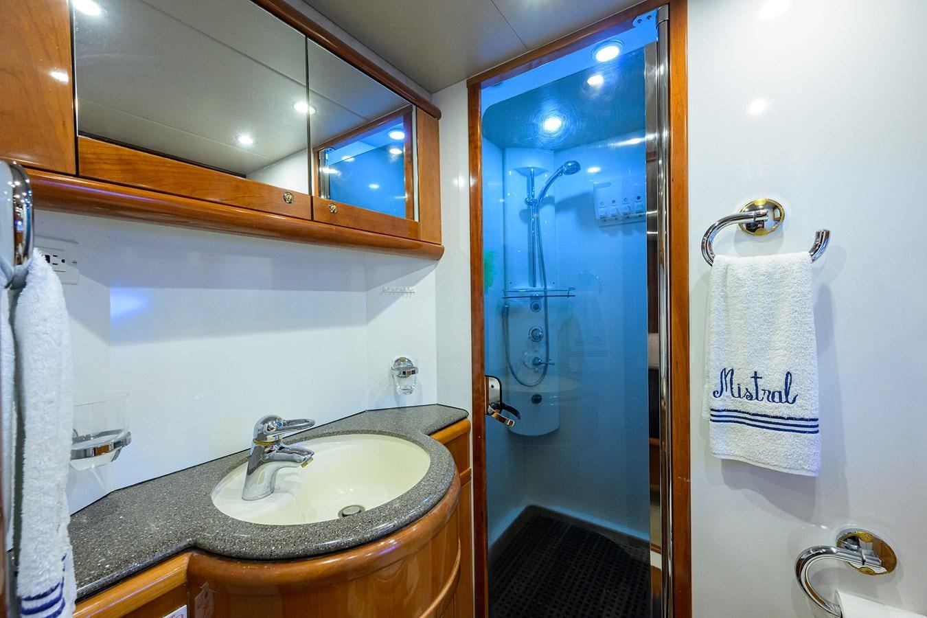 a bathroom with a sink and a mirror aboard MISTRAL Yacht for Sale