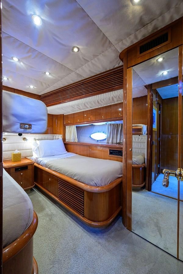 a bed in a room aboard MISTRAL Yacht for Sale