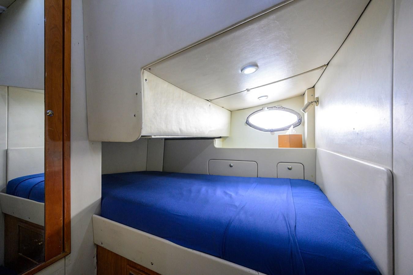 a bed in a room aboard MISTRAL Yacht for Sale