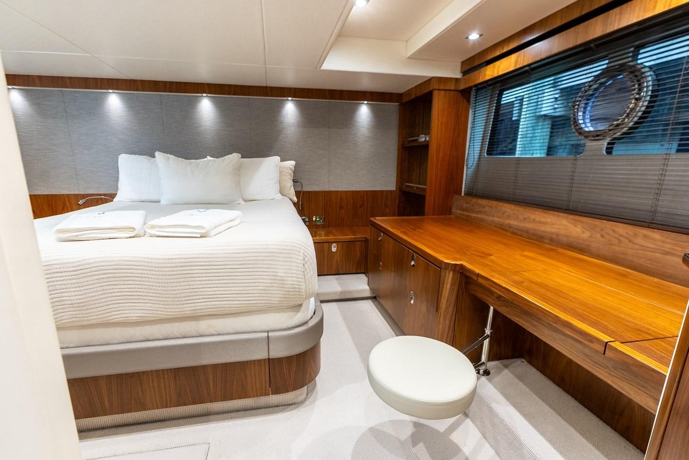 a room with a bed and a window aboard SHANTI Yacht for Sale