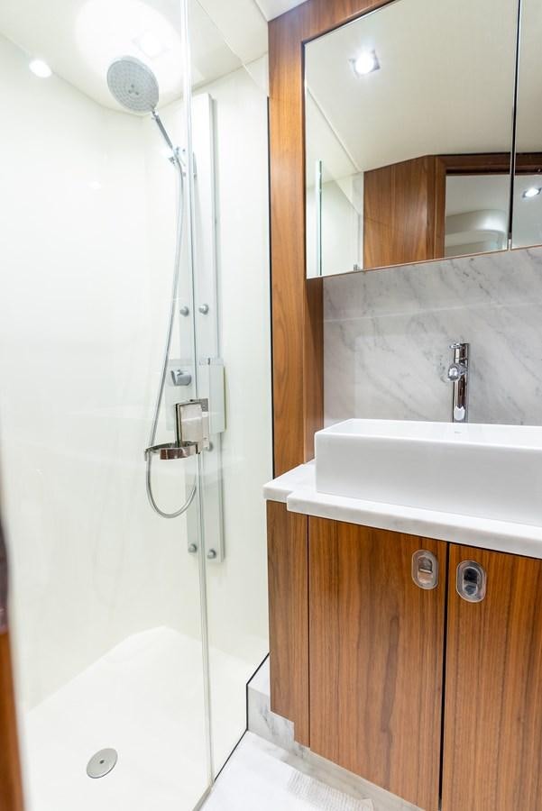 a bathroom with a shower unit aboard SHANTI Yacht for Sale