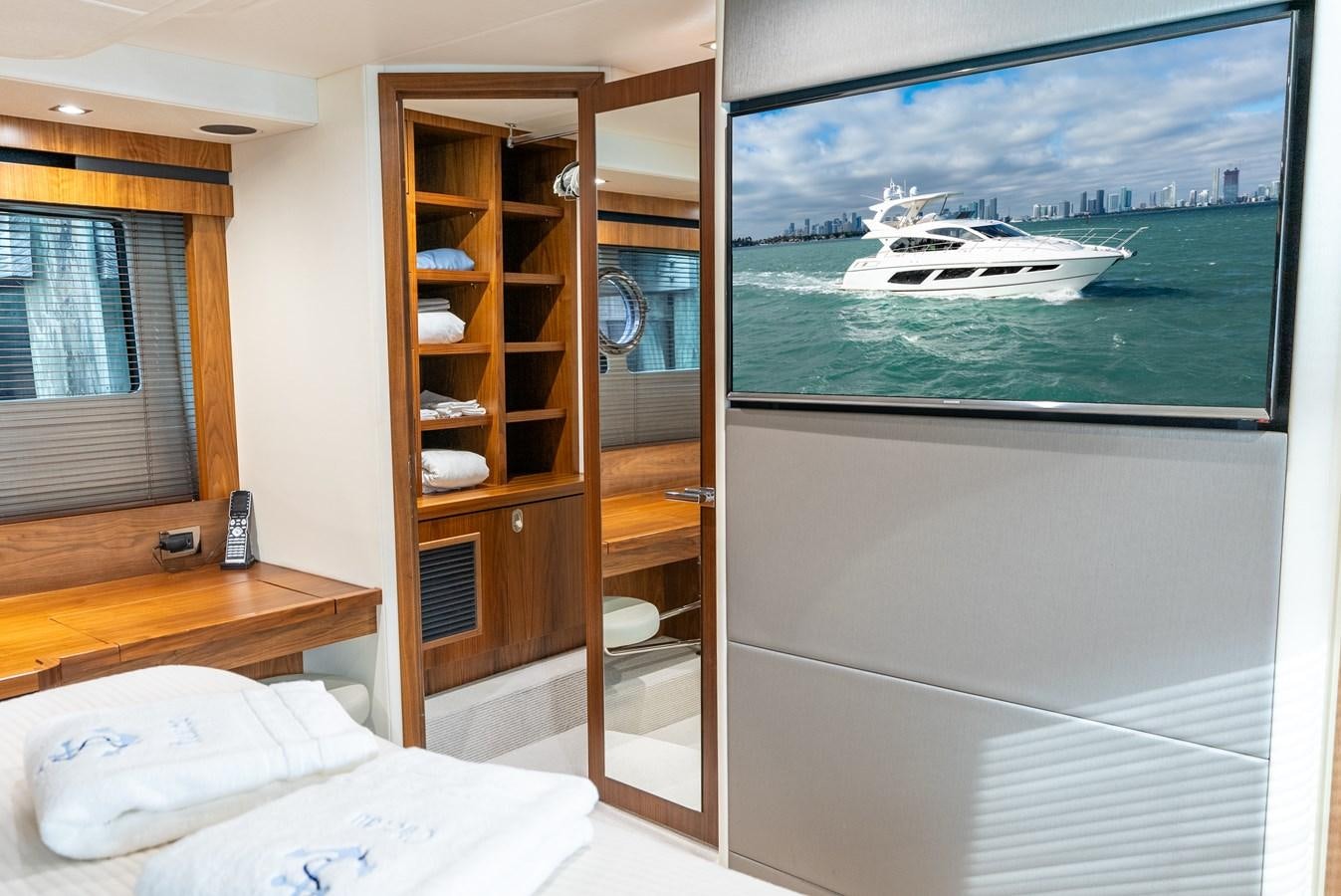 a tv on a wall aboard SHANTI Yacht for Sale