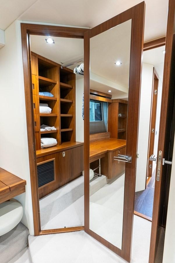 a bathroom with a glass shower aboard SHANTI Yacht for Sale