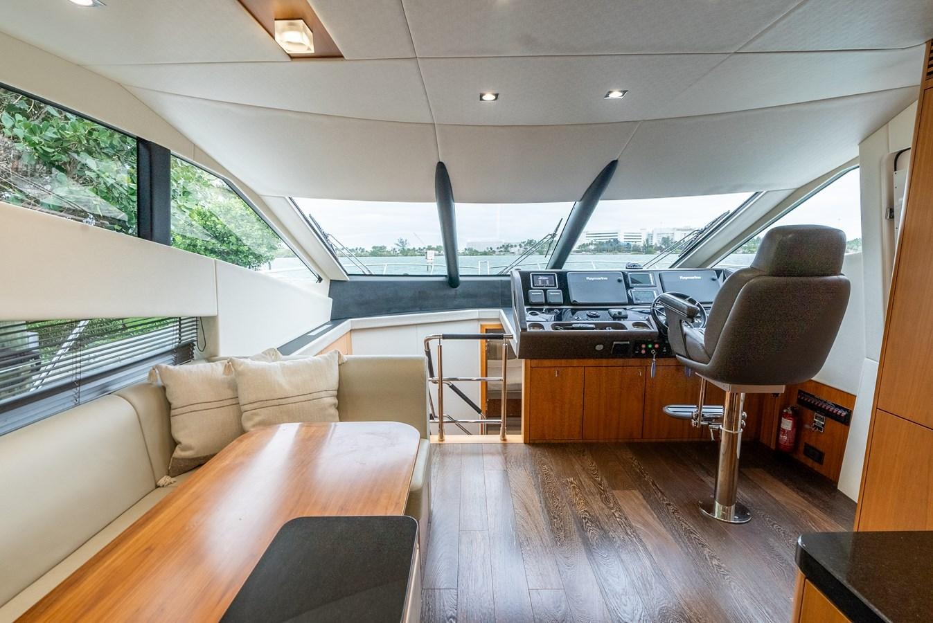 a living room with a couch and a table aboard SHANTI Yacht for Sale