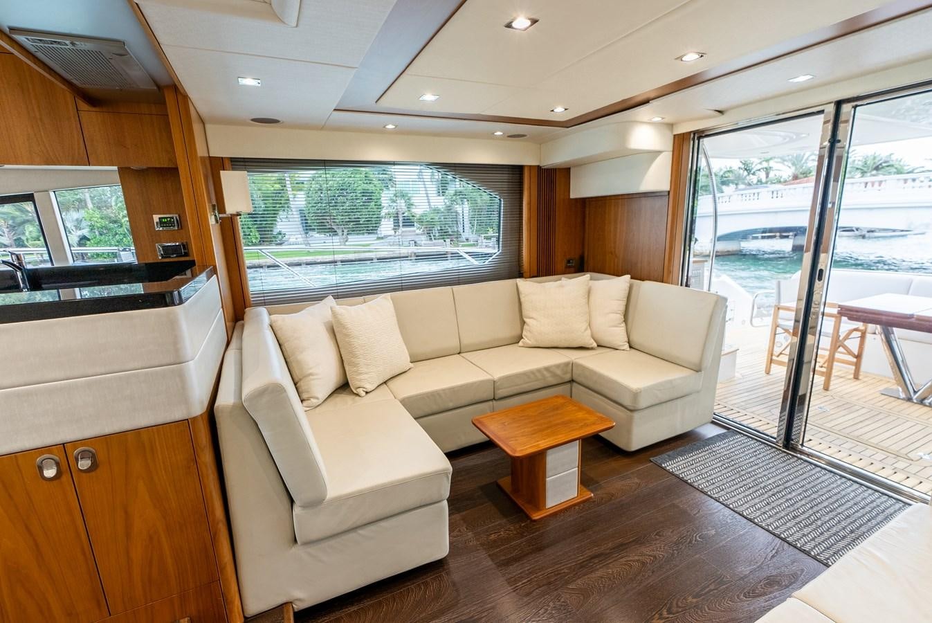 a living room with a couch and a table aboard SHANTI Yacht for Sale