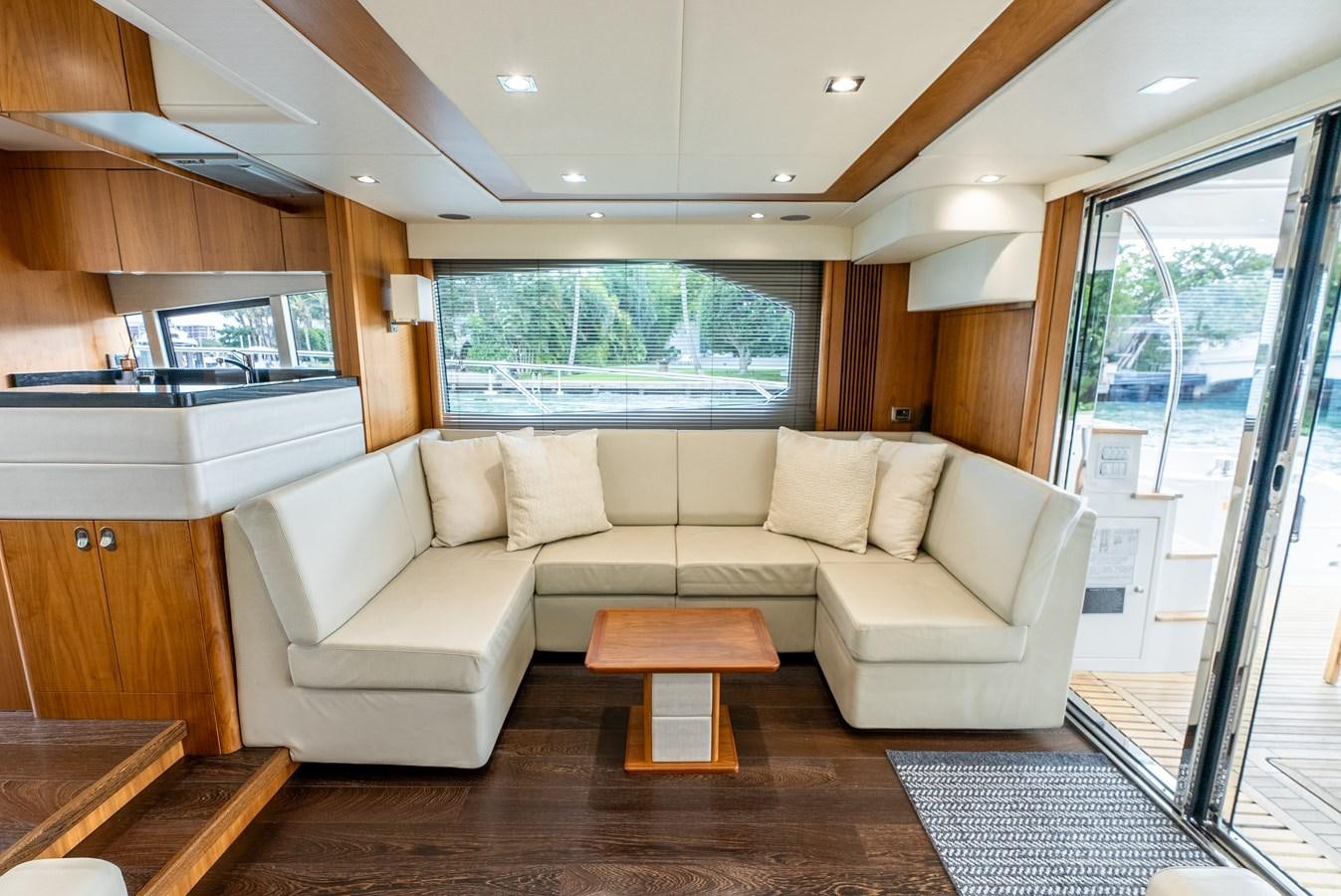 a living room with a couch and a table aboard SHANTI Yacht for Sale