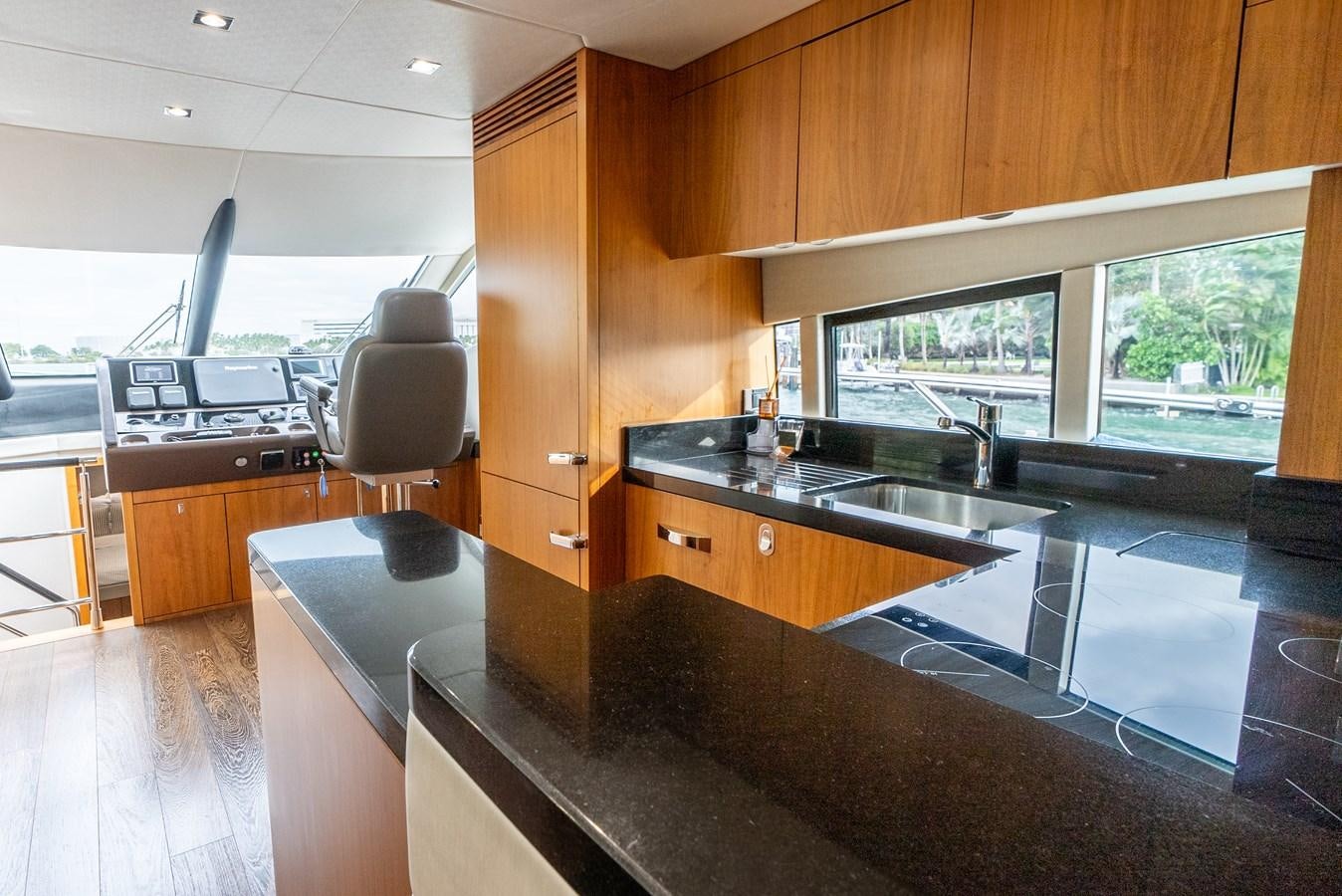 a kitchen with a large island aboard SHANTI Yacht for Sale