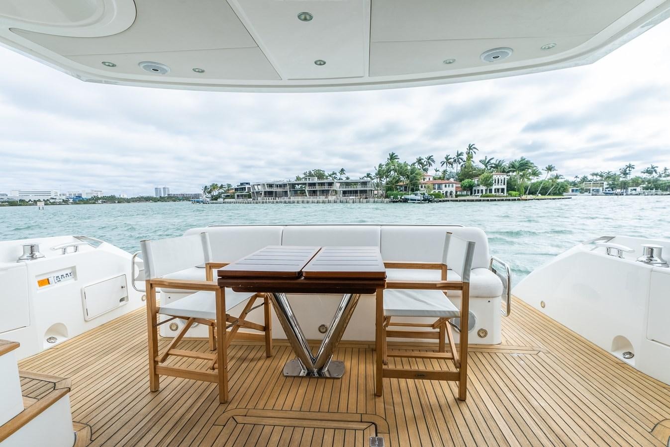 a table and chairs on a deck aboard SHANTI Yacht for Sale