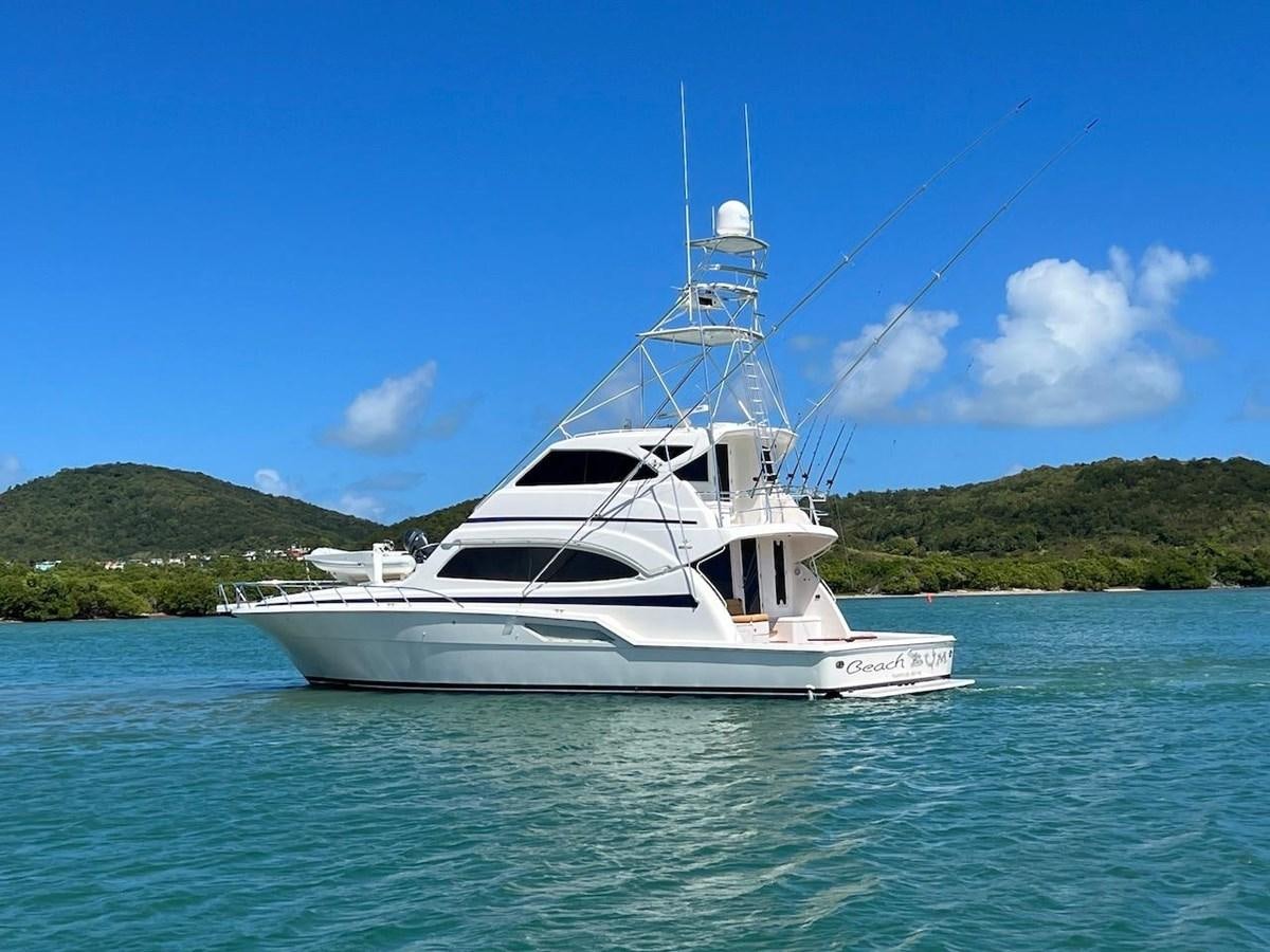 a white boat on the water aboard BEACH BUM Yacht for Sale