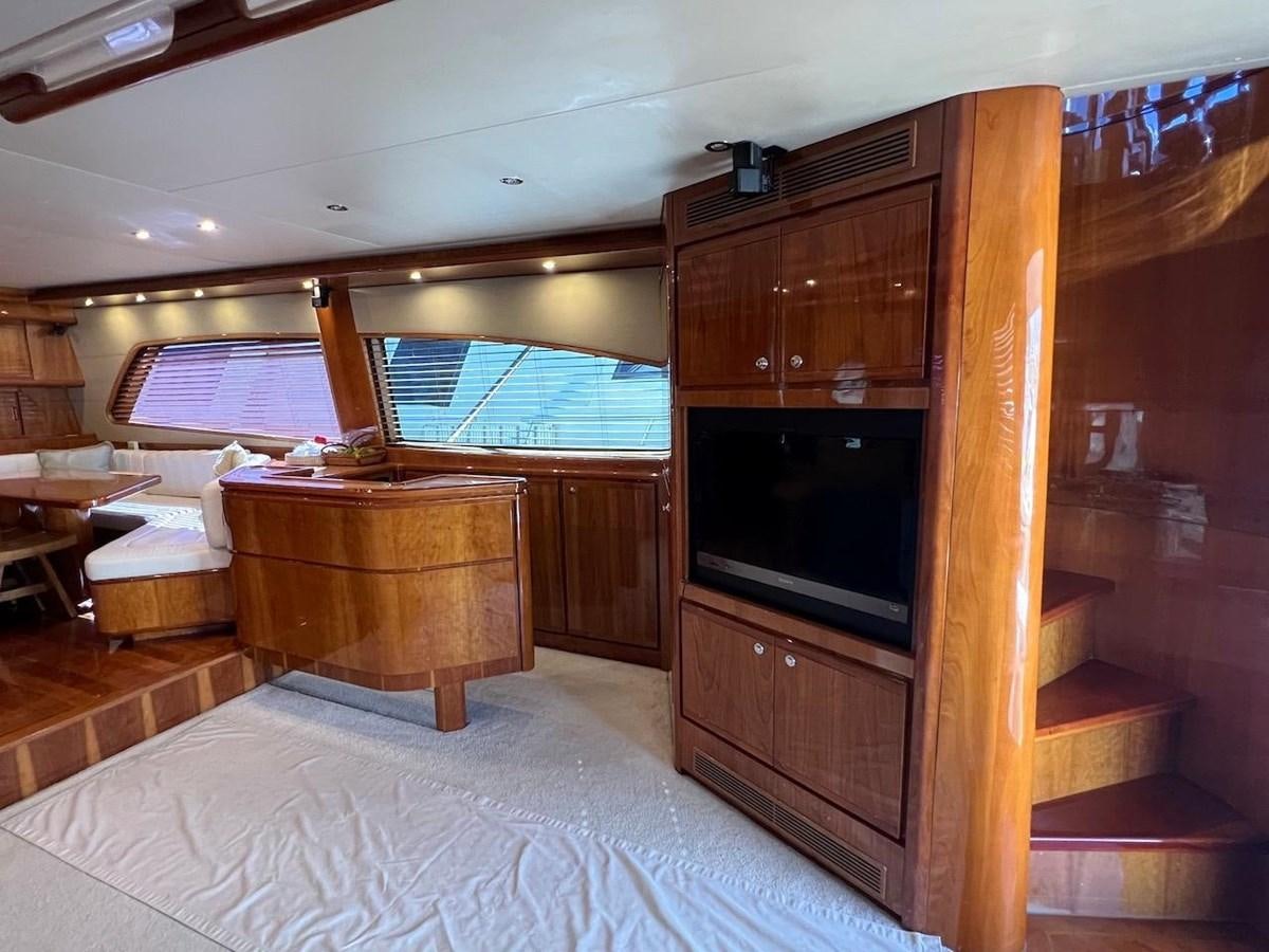 a room with a tv and a bed aboard BEACH BUM Yacht for Sale