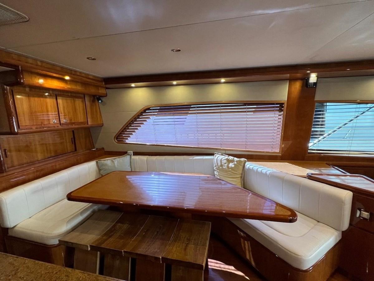 a room with a table and chairs aboard BEACH BUM Yacht for Sale