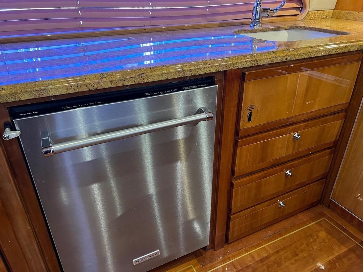 a kitchen with a stainless steel oven aboard BEACH BUM Yacht for Sale