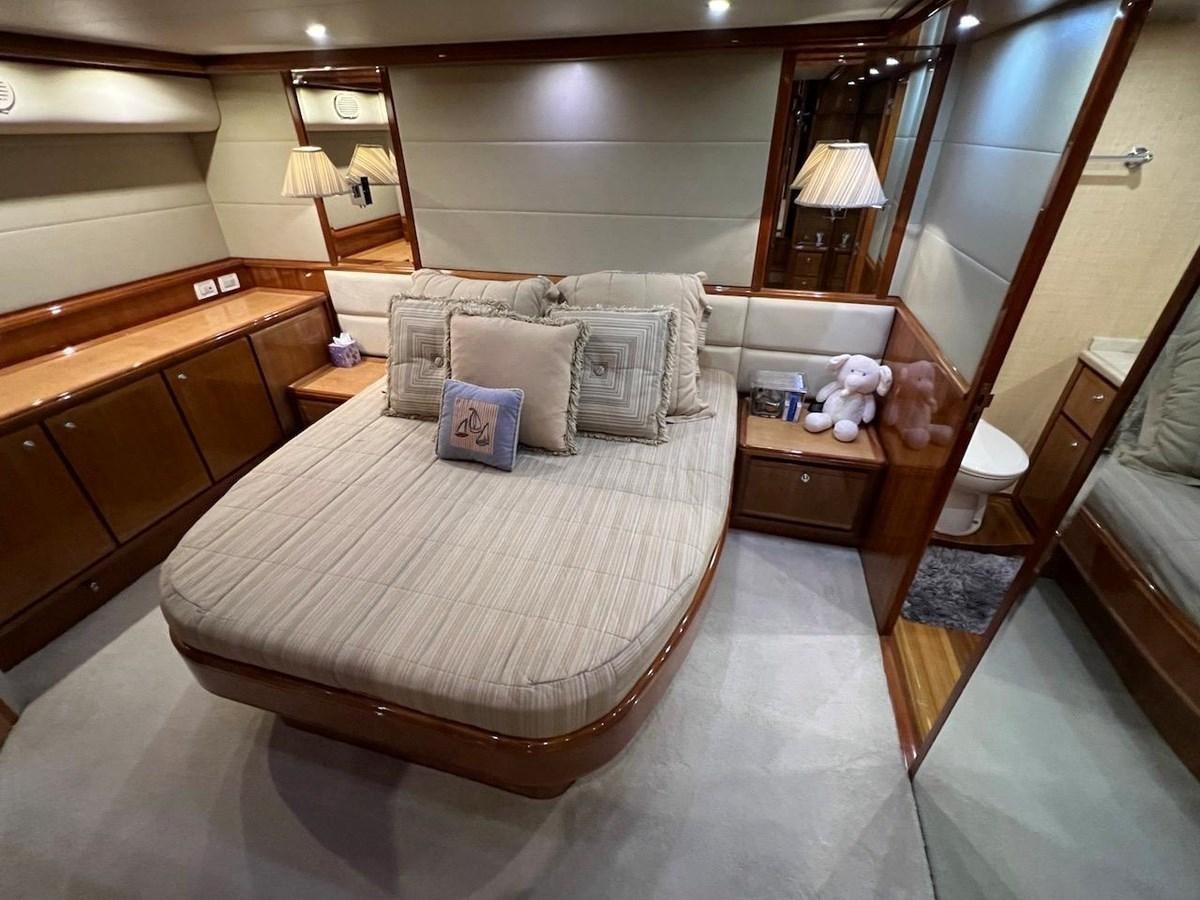 a bed in a hotel room aboard BEACH BUM Yacht for Sale