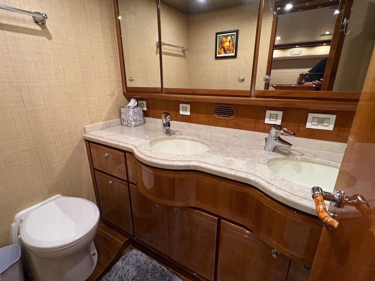 a bathroom with a sink and a toilet aboard BEACH BUM Yacht for Sale