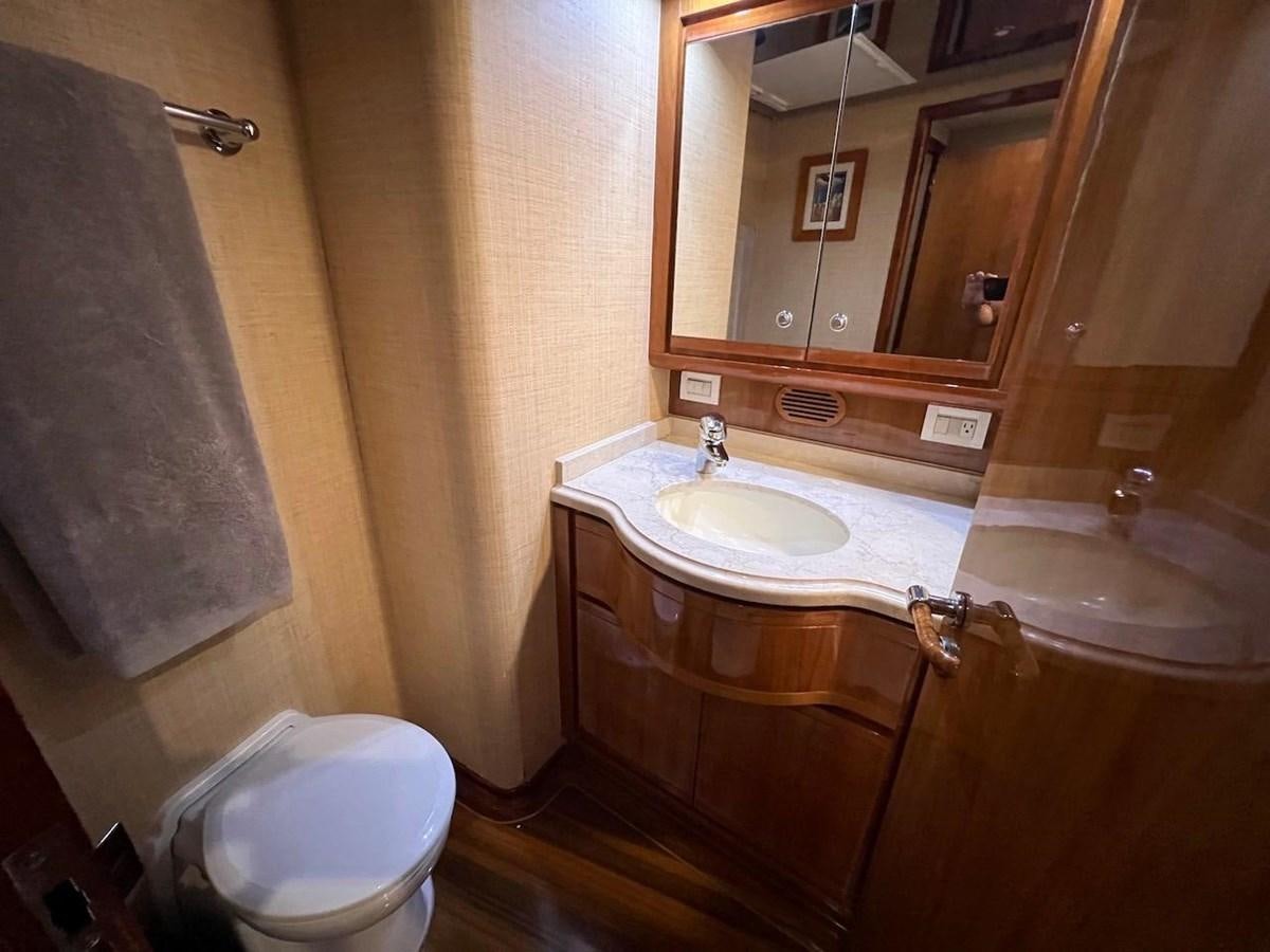 a bathroom with a sink and a toilet aboard BEACH BUM Yacht for Sale
