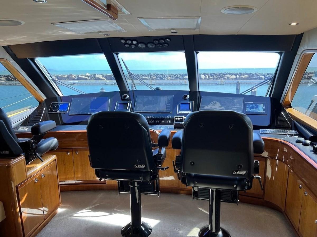 inside of a vehicle with chairs and a large screen aboard BEACH BUM Yacht for Sale