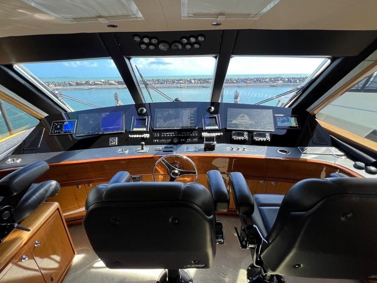 inside of a vehicle with seats and a view of the water aboard BEACH BUM Yacht for Sale