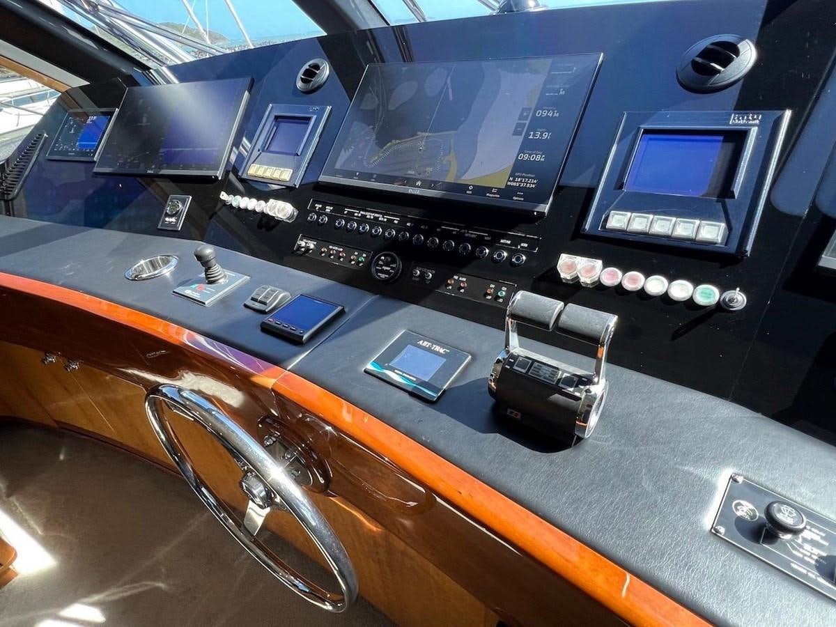 a group of electronic devices on a table aboard BEACH BUM Yacht for Sale