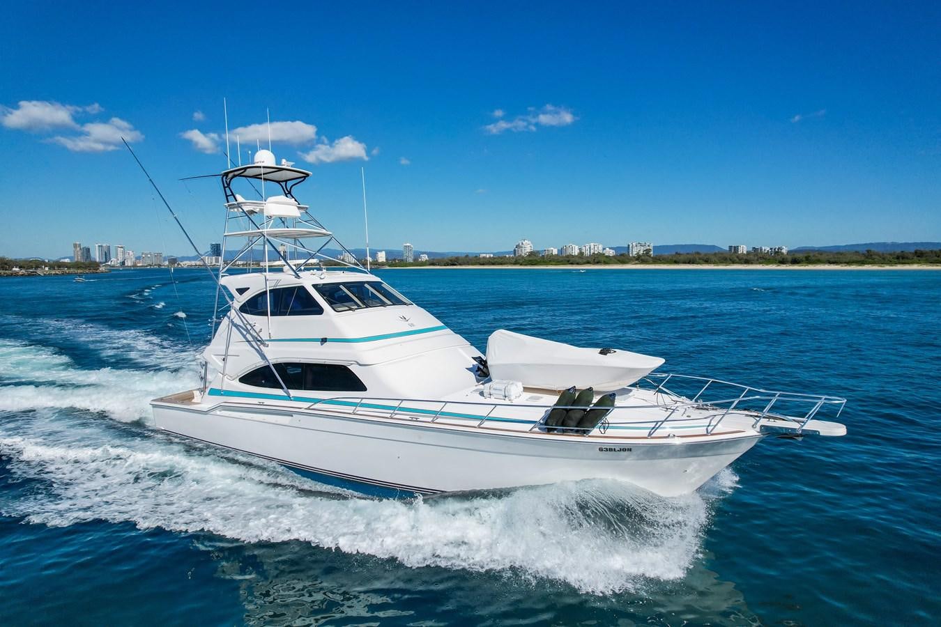a white yacht on the water aboard ISLAND KAI Yacht for Sale