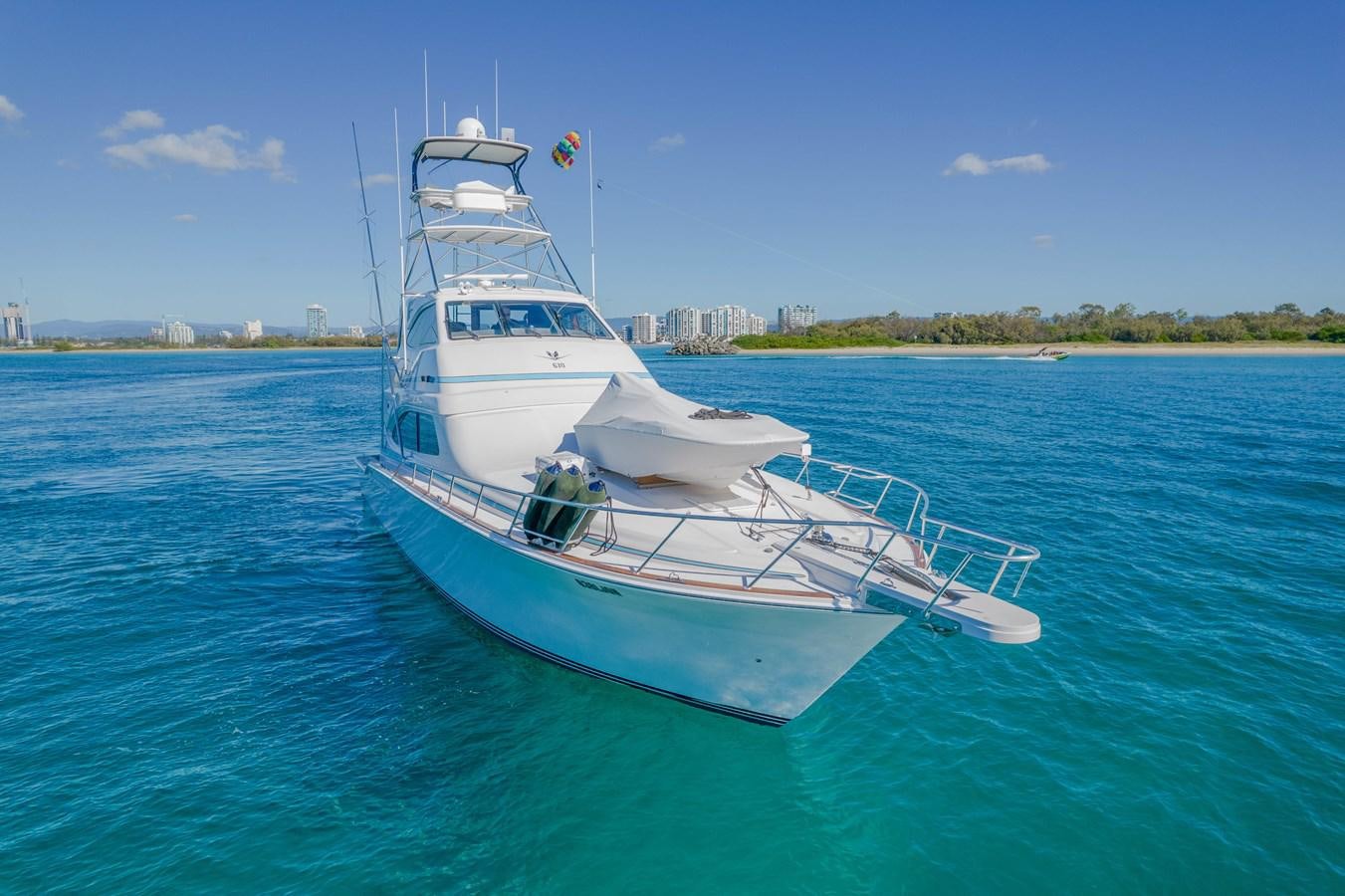 a white boat in the water aboard ISLAND KAI Yacht for Sale