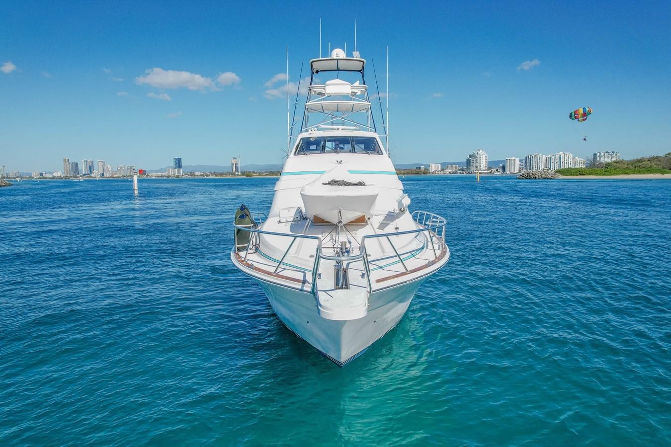 a large white boat in the water aboard ISLAND KAI Yacht for Sale