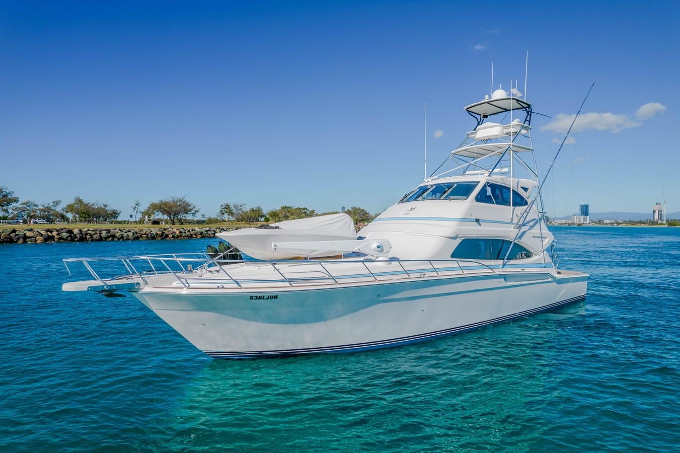 a white boat in the water aboard ISLAND KAI Yacht for Sale