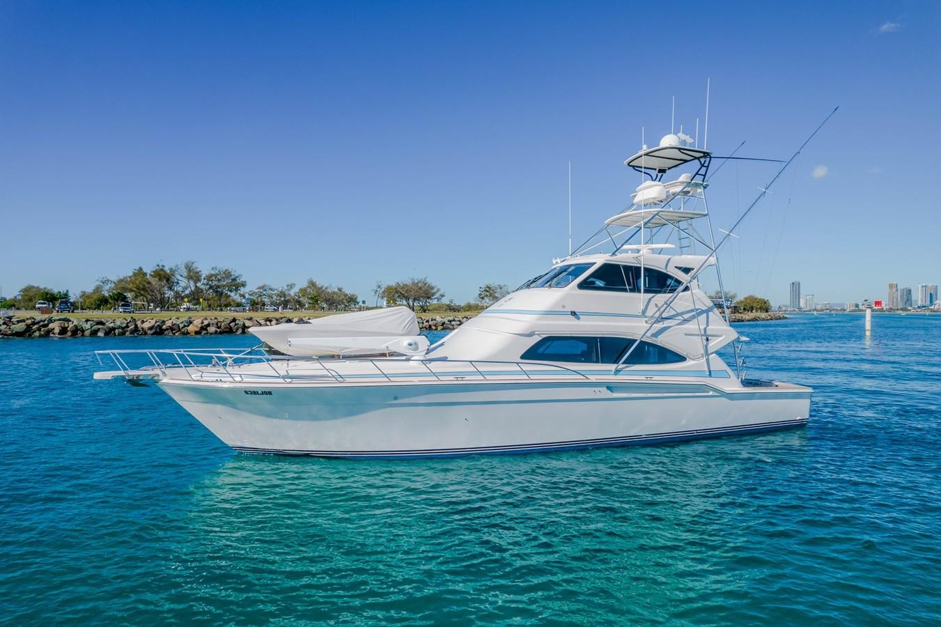 a white boat in the water aboard ISLAND KAI Yacht for Sale