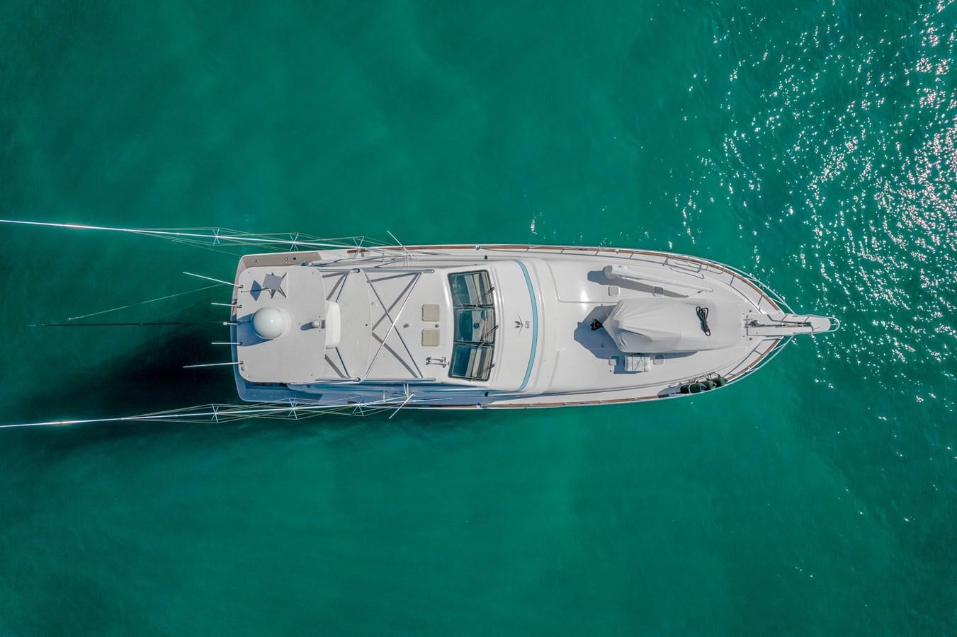 a white boat in the water aboard ISLAND KAI Yacht for Sale