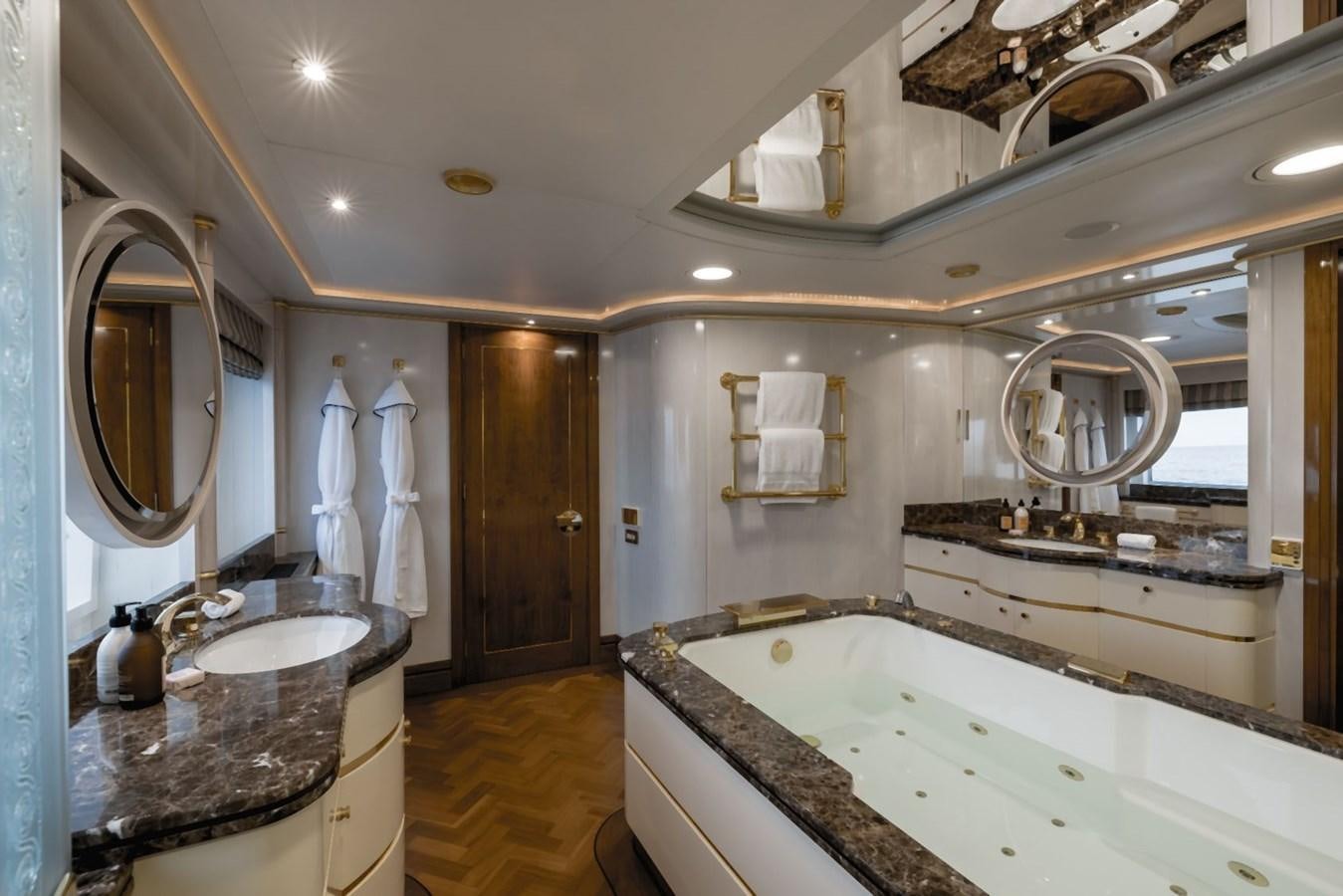 a bathroom with a large bathtub aboard OLYMPUS Yacht for Sale