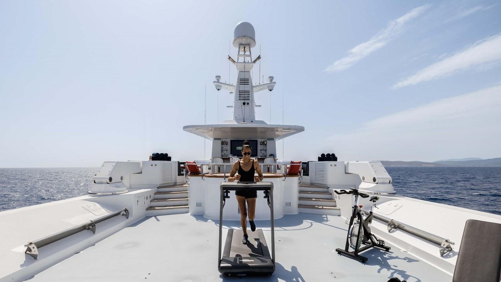 a person standing on a platform on a boat with a camera on it aboard OLYMPUS Yacht for Sale