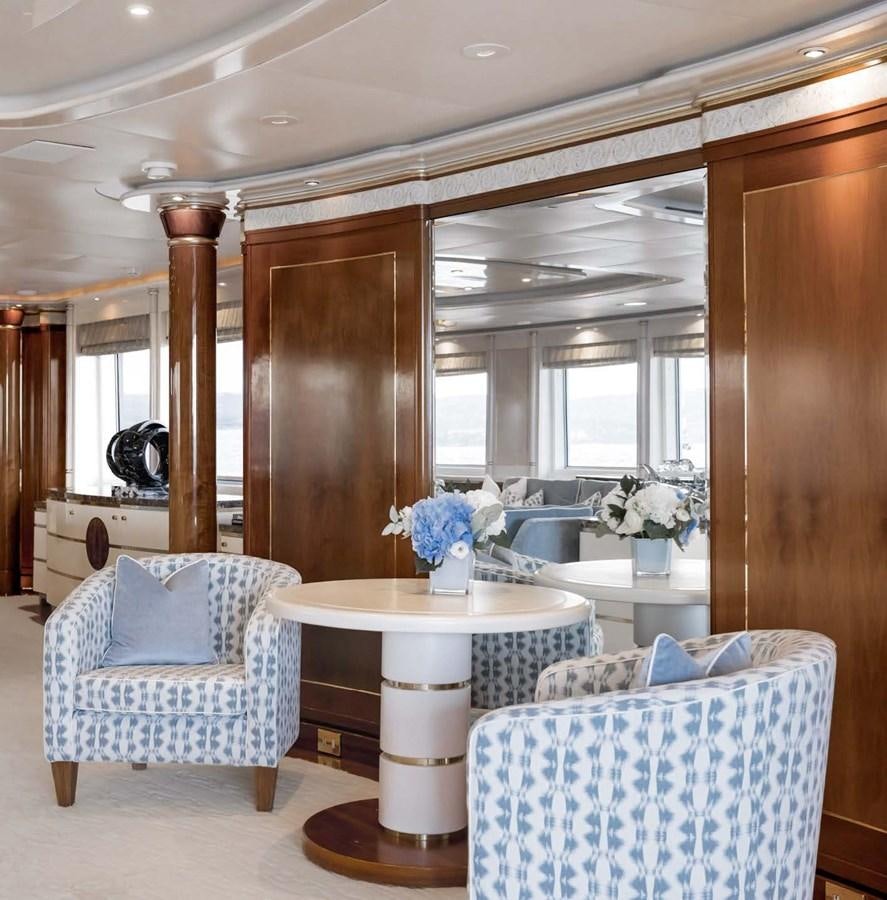 a dining room with a table and chairs aboard OLYMPUS Yacht for Sale