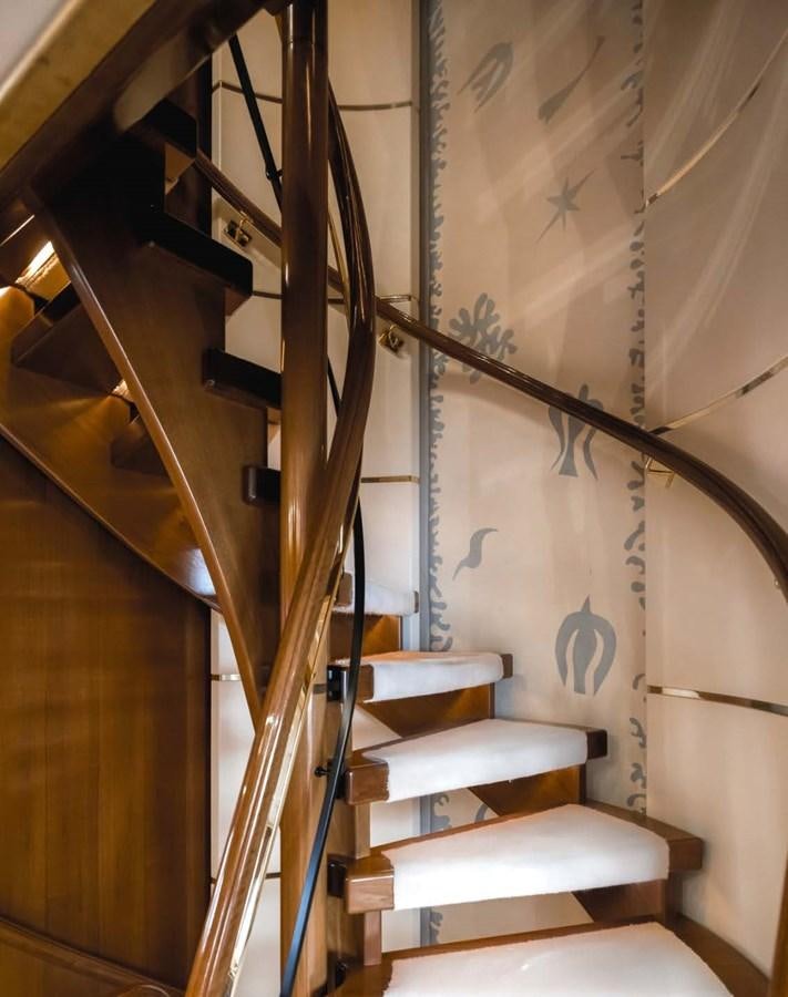 a staircase with a set of stairs aboard OLYMPUS Yacht for Sale