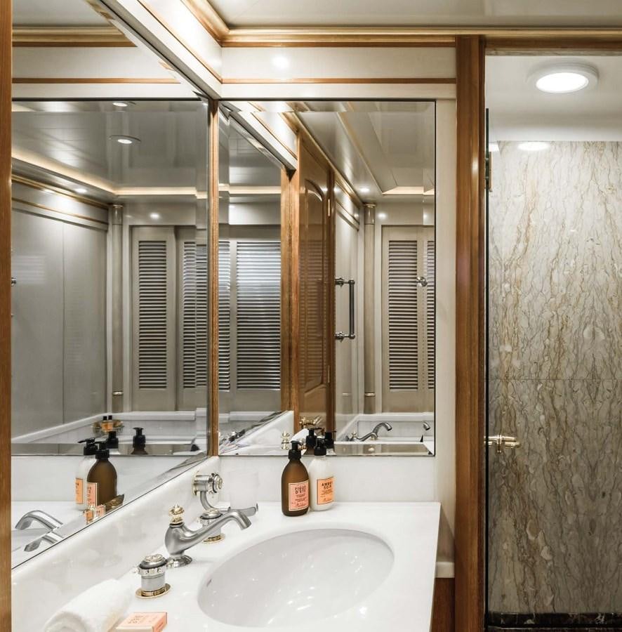 a bathroom with a large mirror aboard OLYMPUS Yacht for Sale