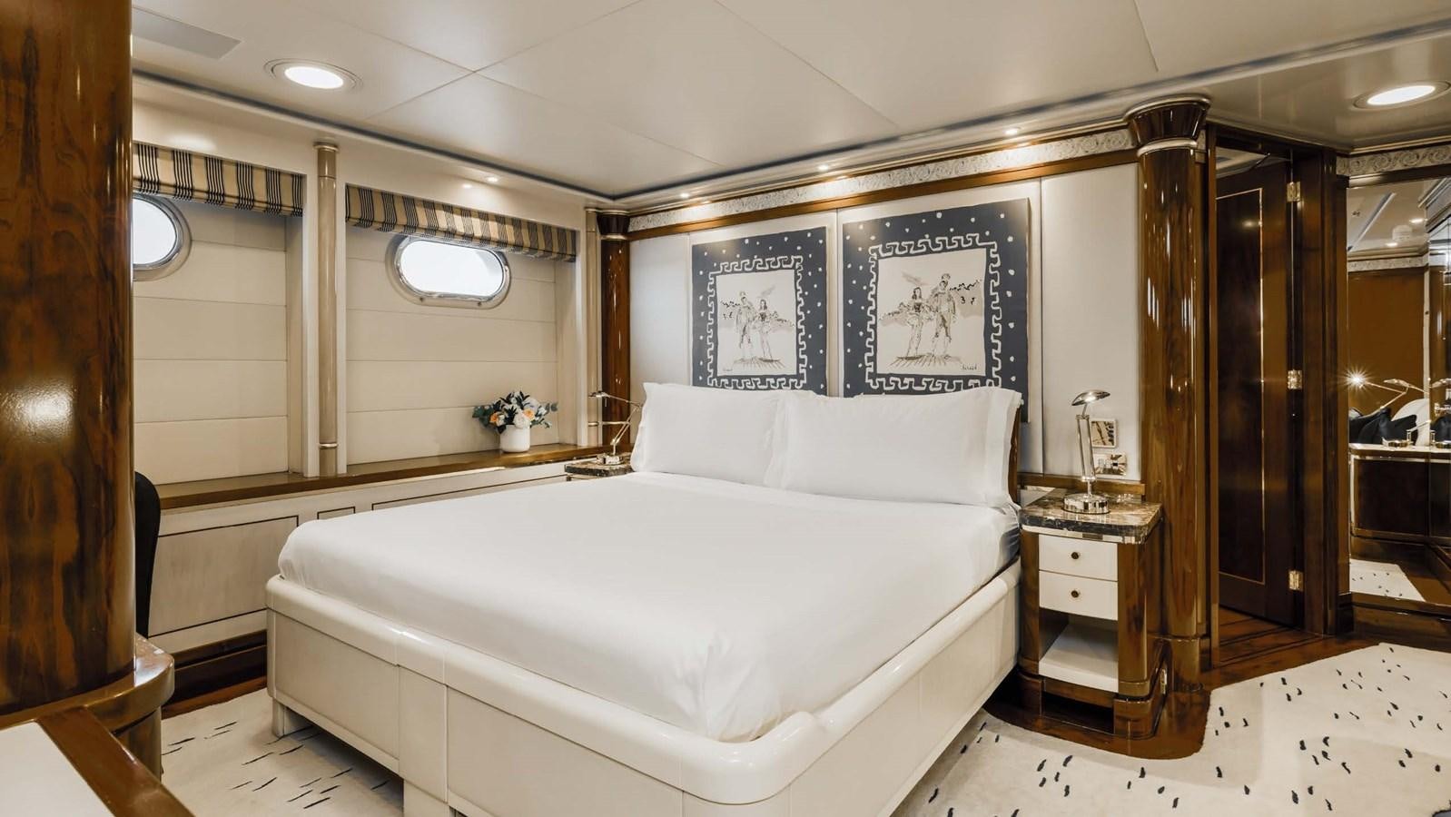 a large bedroom with a large bed aboard OLYMPUS Yacht for Sale