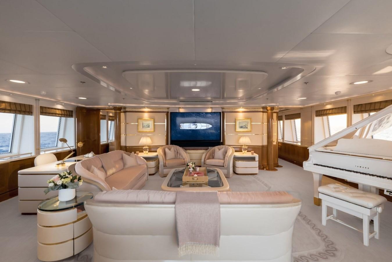a living room with a large screen aboard OLYMPUS Yacht for Sale