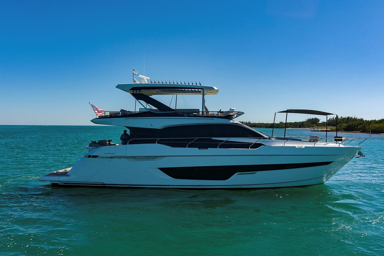 a white boat in the water aboard RAW WAVE Yacht for Sale