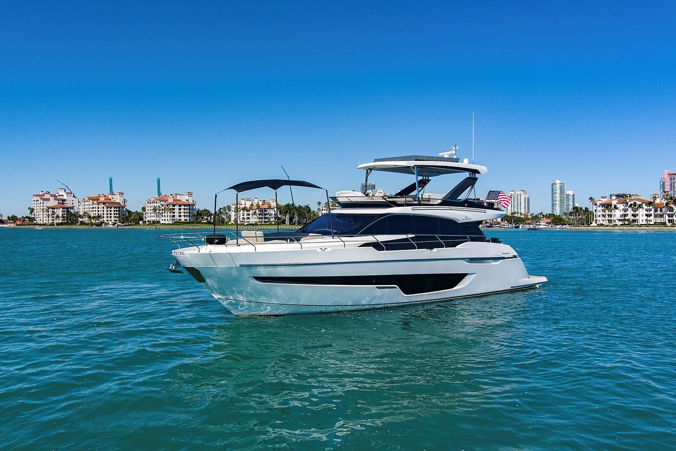 a white yacht in the water aboard RAW WAVE Yacht for Sale