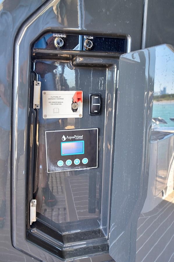 a black rectangular object with a screen aboard RAW WAVE Yacht for Sale