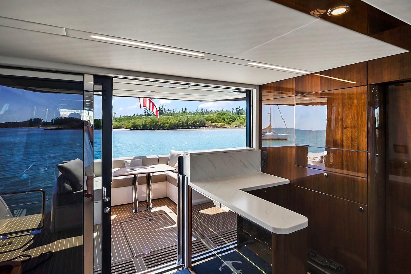 a room with a table and chairs aboard RAW WAVE Yacht for Sale