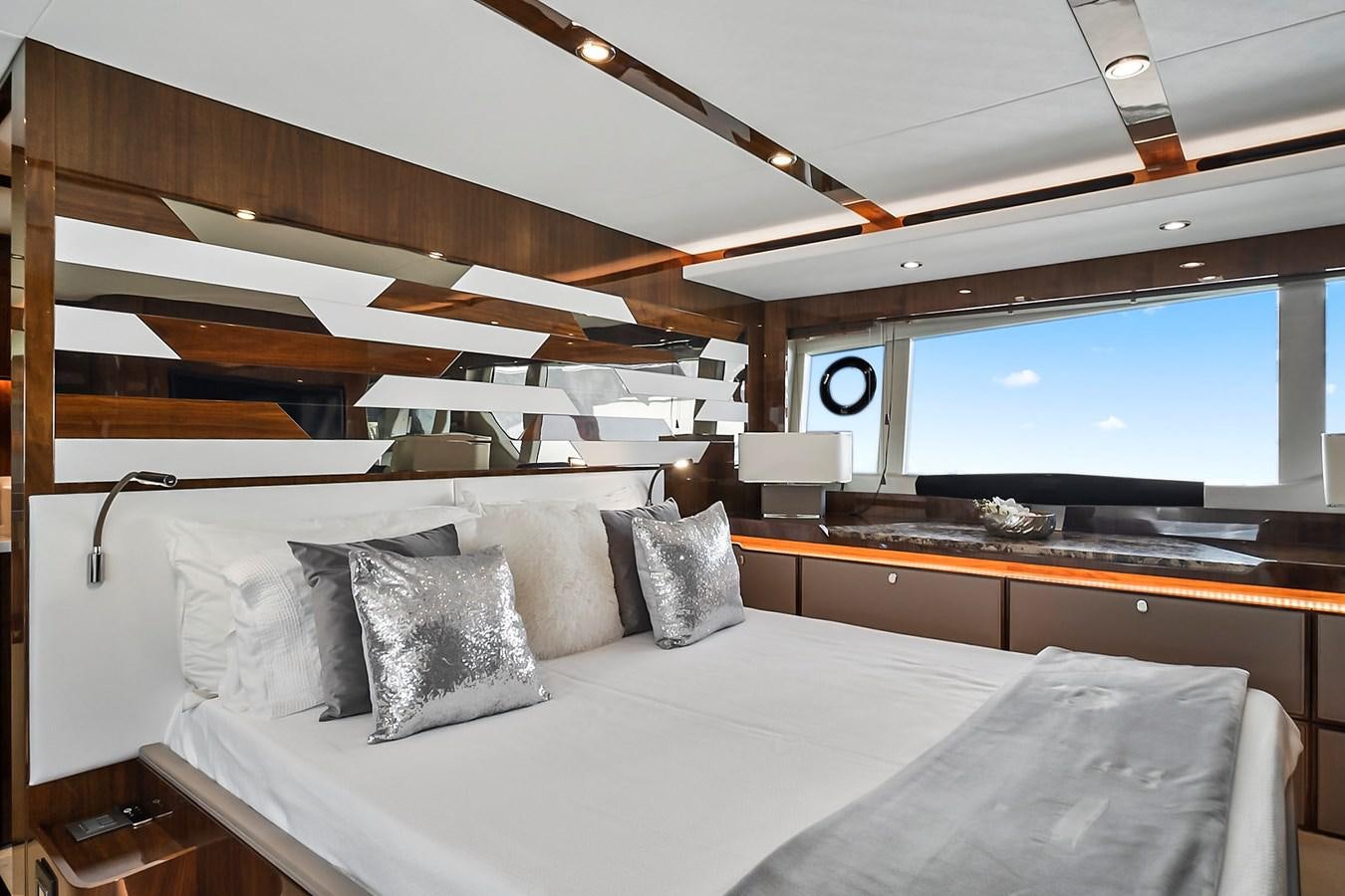 a room with a bed and a large window aboard RAW WAVE Yacht for Sale