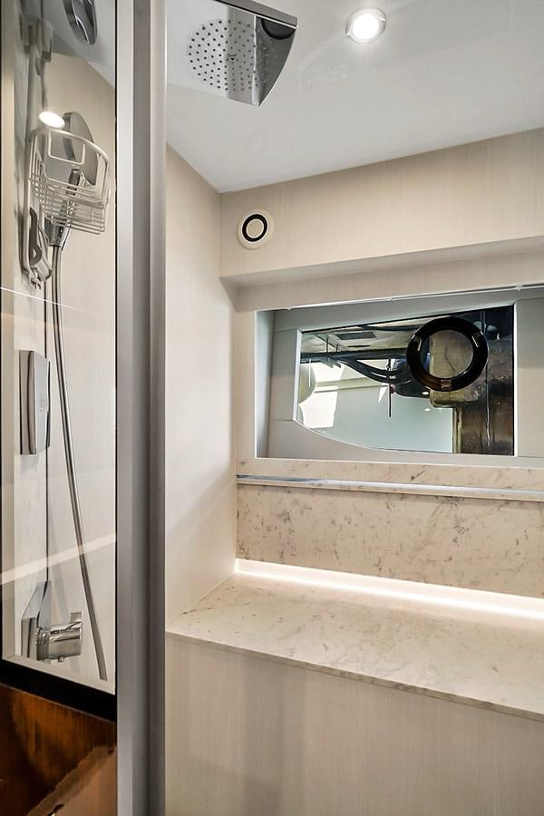 a bathroom with a mirror aboard RAW WAVE Yacht for Sale