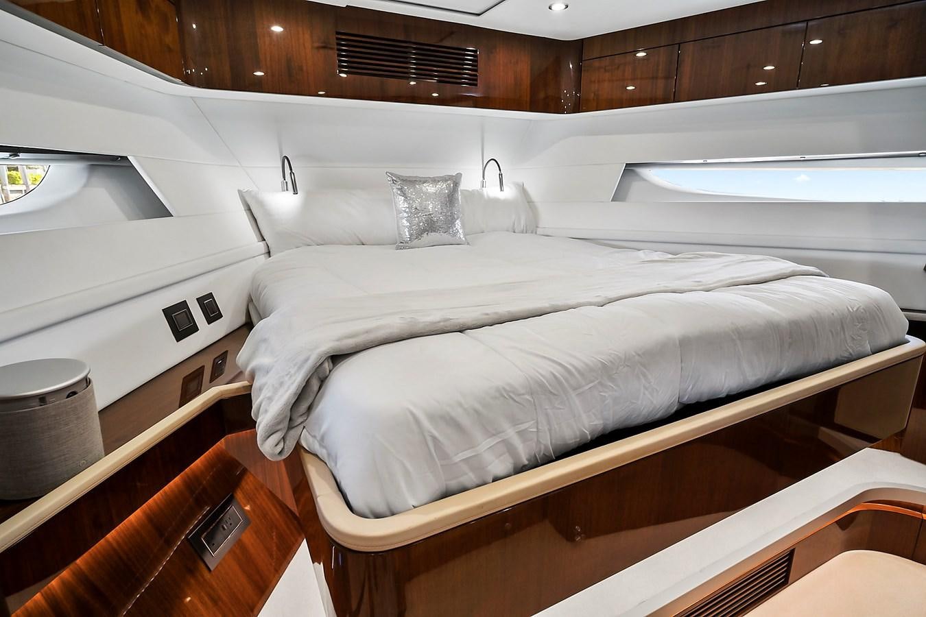 a bed with white sheets aboard RAW WAVE Yacht for Sale