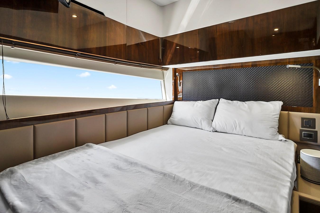 a bed with white sheets aboard RAW WAVE Yacht for Sale