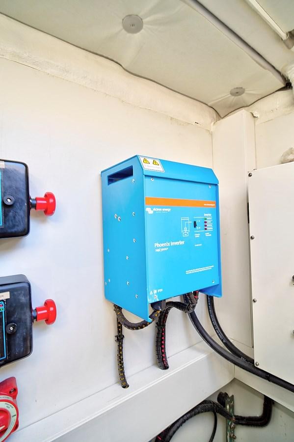 a blue and white electrical box aboard RAW WAVE Yacht for Sale