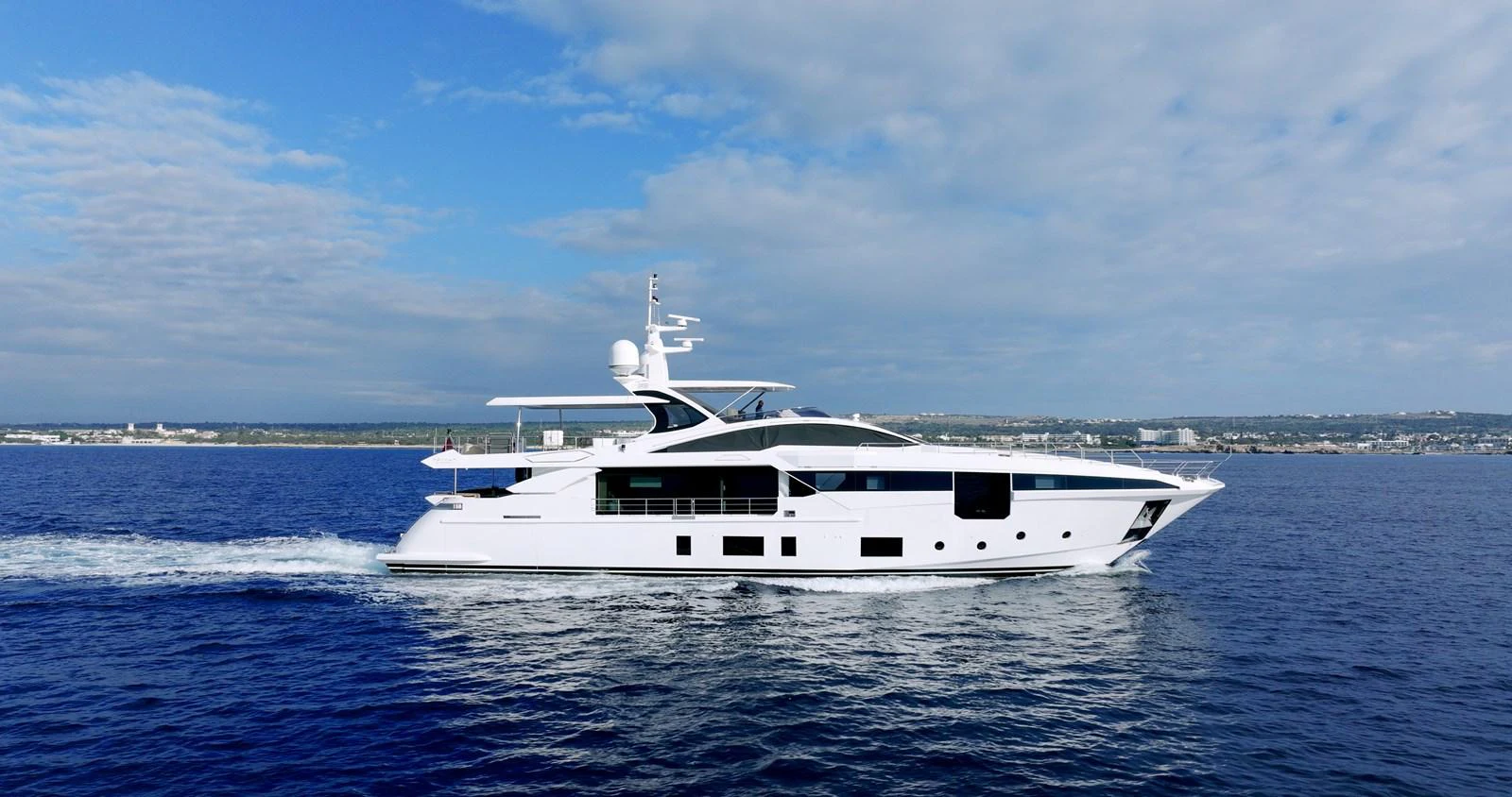 a white yacht in the water aboard IRYNA Yacht for Sale