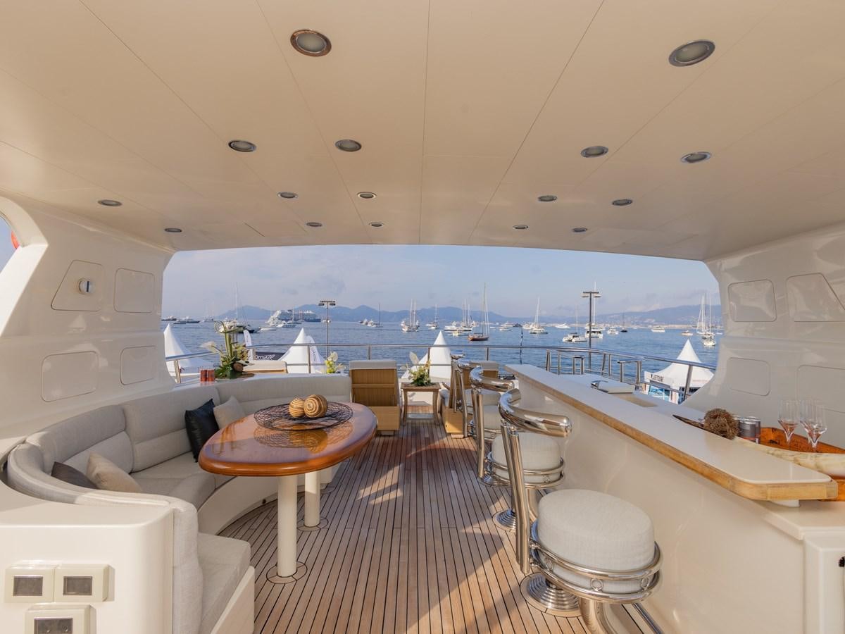 a room with a table and chairs aboard BANDIDO I Yacht for Sale