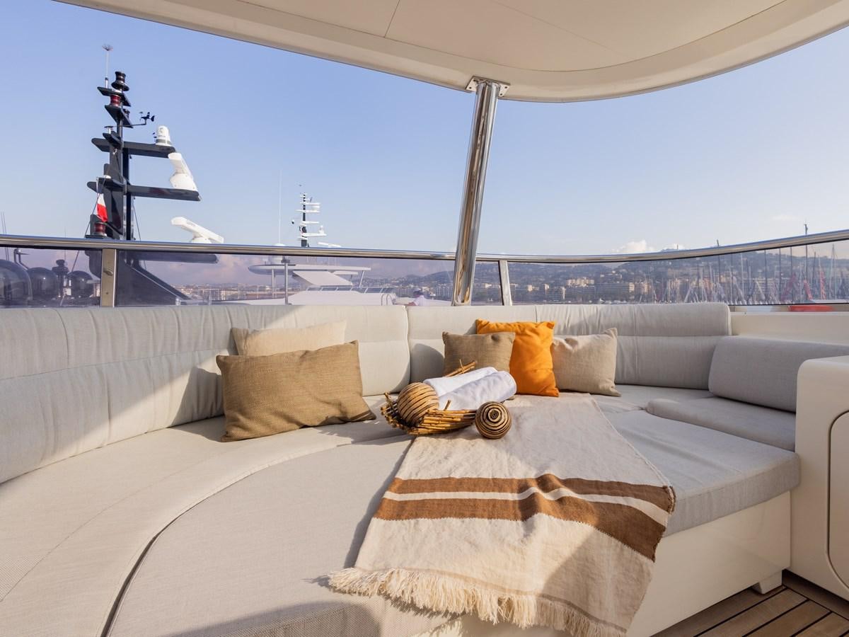 a white couch with pillows on it aboard BANDIDO I Yacht for Sale