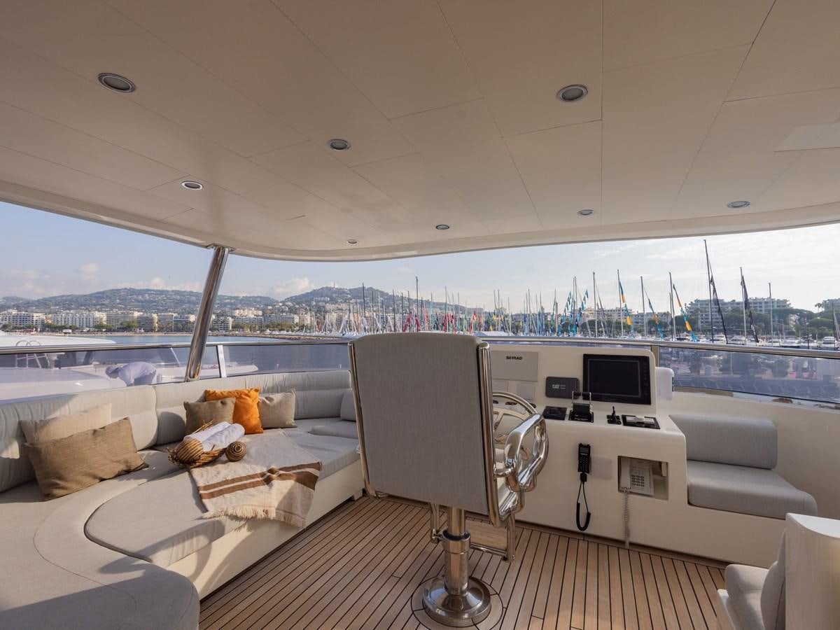 a room with a view of the city and water aboard BANDIDO I Yacht for Sale