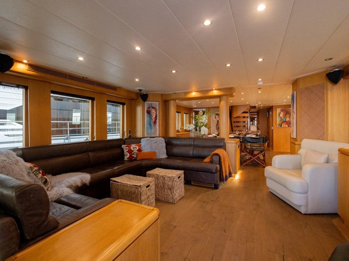 a living room with leather couches aboard BANDIDO I Yacht for Sale