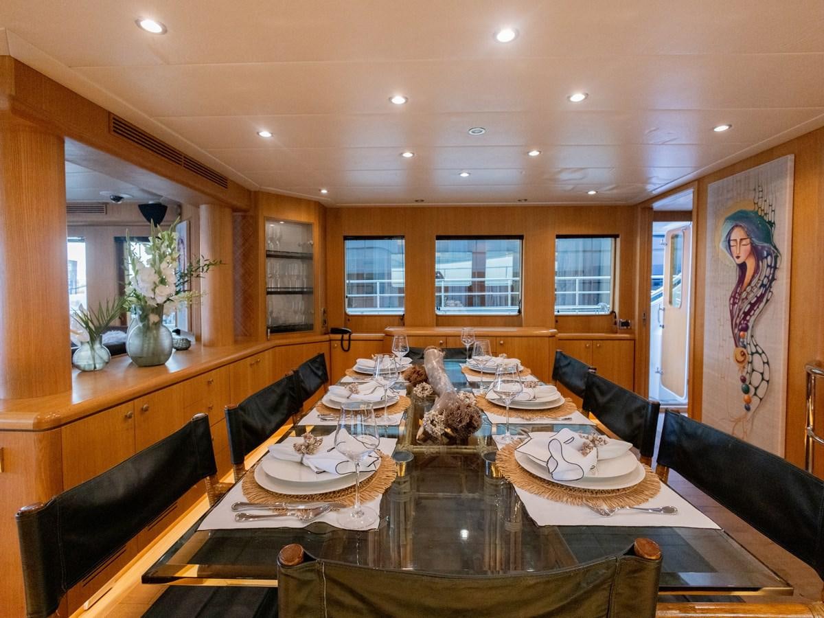a dining room with a large table aboard BANDIDO I Yacht for Sale